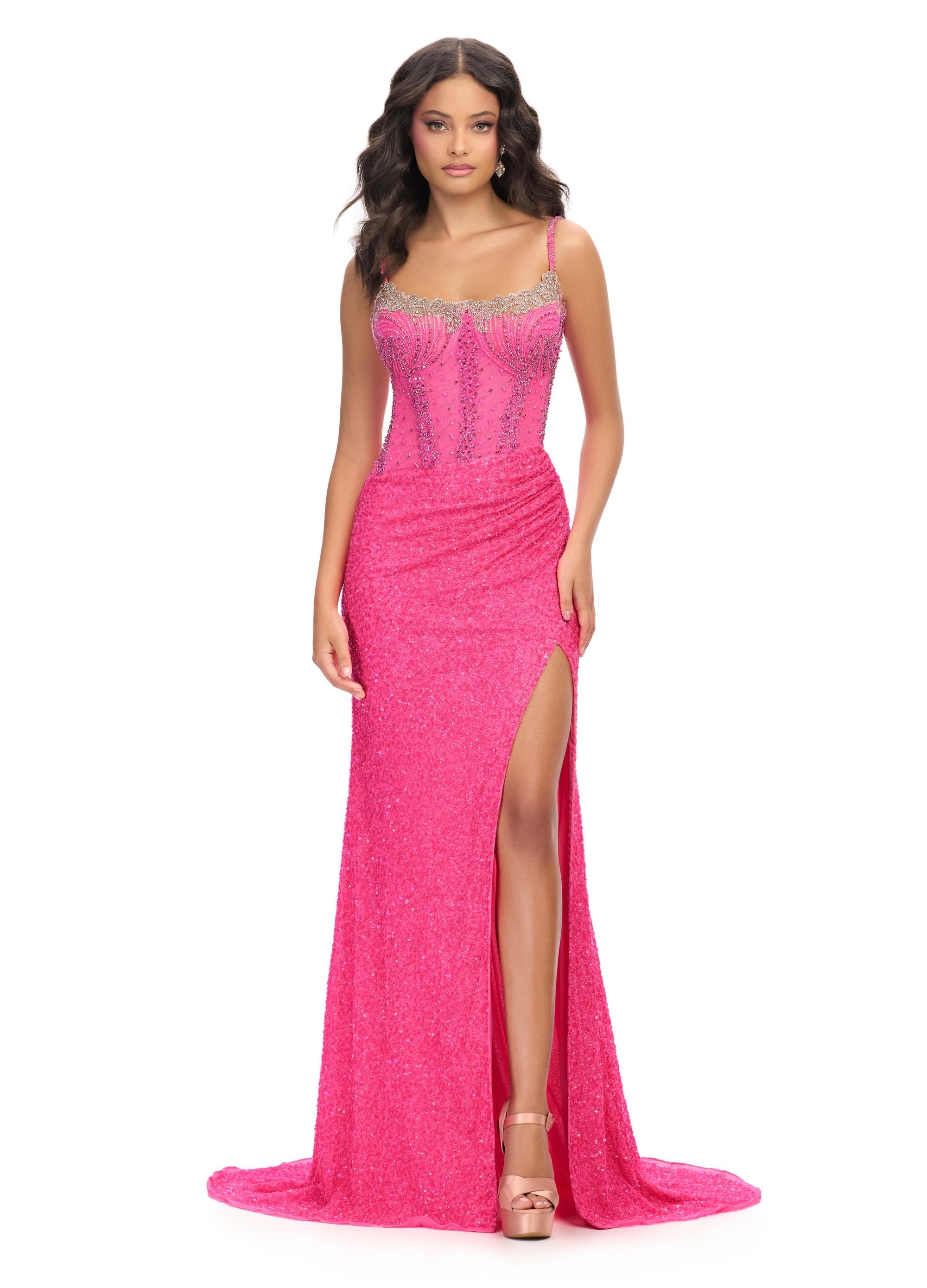 Pink ASHLEYlauren 11711 elegant gown featuring a fully hand-beaded bodice, spaghetti straps, corset bustier, illusion neckline, and a left leg slit for a glamorous and sophisticated look.