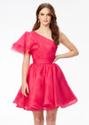 Pink ASHLEYlauren 4524 organza cocktail dress featuring a one shoulder neckline with a flutter sleeve, an A-line skirt with a wire hem for added structure, and a playful, sassy vibe.