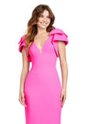 Pink ASHLEYlauren 4656 – A chic scuba cocktail dress featuring a deep illusion V-neckline, oversized bow details, and a fitted skirt for a flattering and stylish look. Perfect for any special occasion.