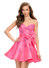 Pink ASHLEYlauren 4724 cocktail dress featuring a sweetheart neckline, press-on stones in a bow design, an oversized satin bow at the waist, and an A-line skirt for a chic and elegant look.
