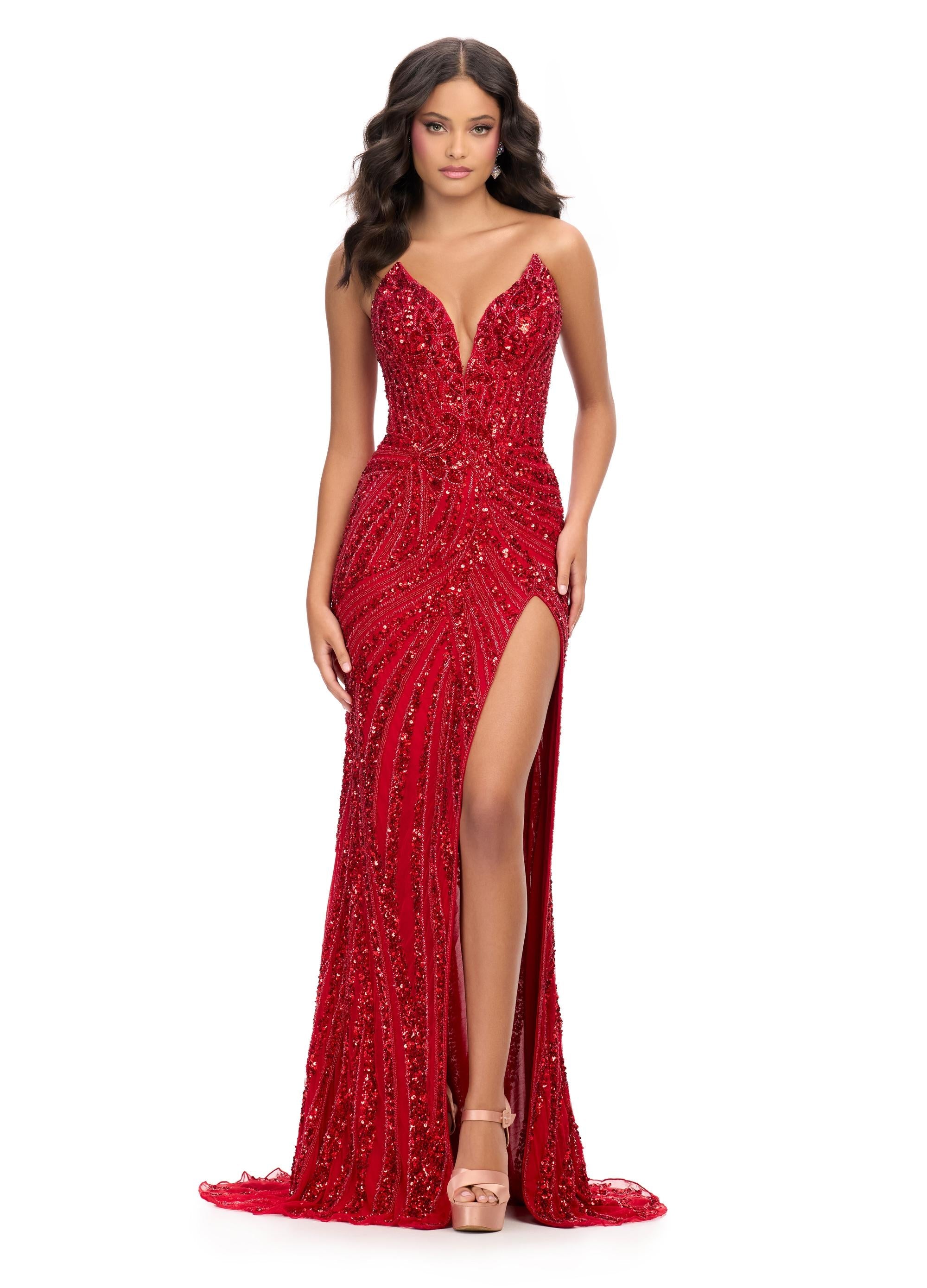 Red ASHLEYlauren 11236 strapless gown featuring a sweetheart neckline, modern floral sequin motif cascading down the bustier and skirt, and a left leg slit for a glamorous and head-turning look.