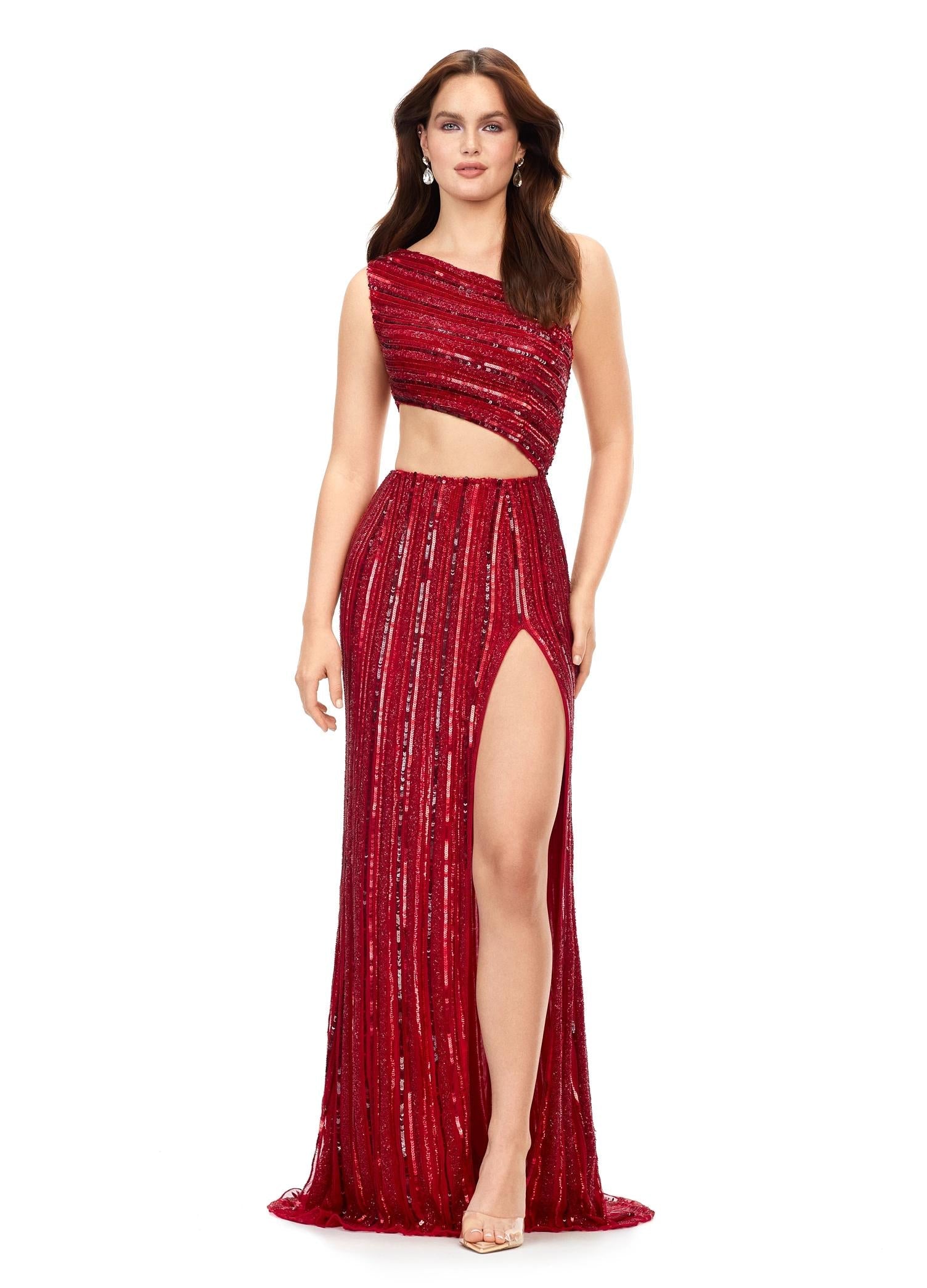 Red ASHLEYlauren 11240 fully hand-beaded one shoulder gown featuring an intricate bead pattern designed to accentuate curves, a bold cut out detail, and a left leg slit for a striking and glamorous look.
