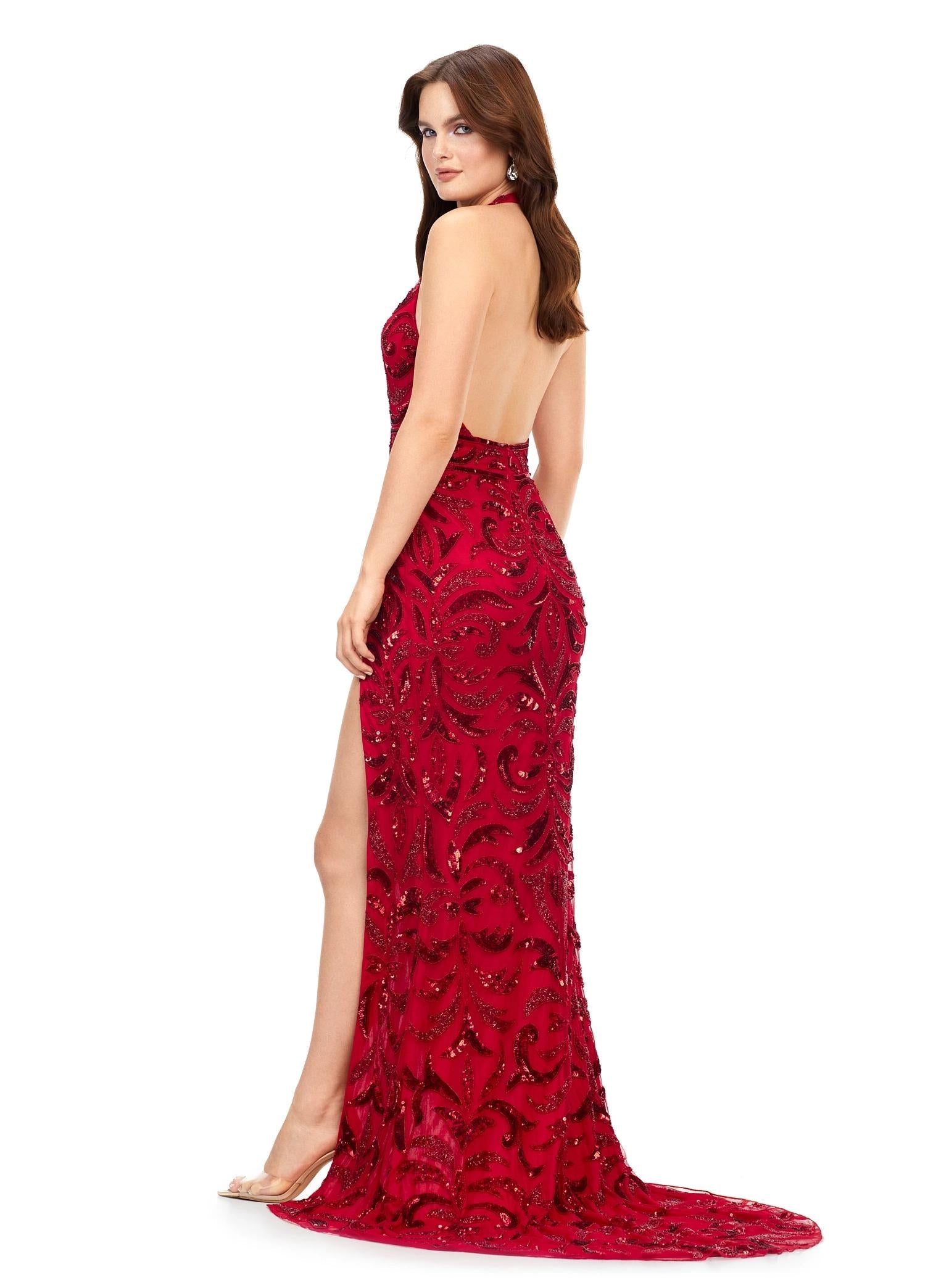 Back - Red ASHLEYlauren 11283 halter gown featuring a V-neckline, open back, intricate beading throughout, and a left leg slit.