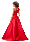 Back - Red ASHLEYlauren 11336 one shoulder ball gown in Mikado fabric, featuring feather-embellished neckline and a classic A-line skirt.