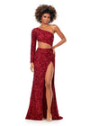 Red ASHLEYlauren 11340 sequin one shoulder gown featuring a single sleeve, shark bite cut-out, wrap skirt, and left leg slit for a striking and glamorous look.