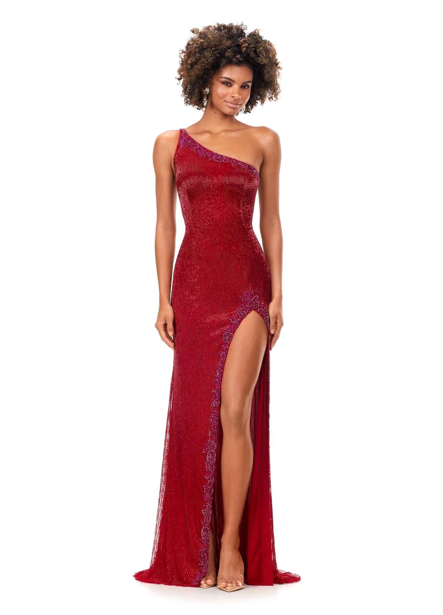 Red ASHLEYlauren 11352 liquid beaded gown featuring a one shoulder neckline with crystal trim, a left leg slit, and a sweep train for an elegant and sophisticated look.