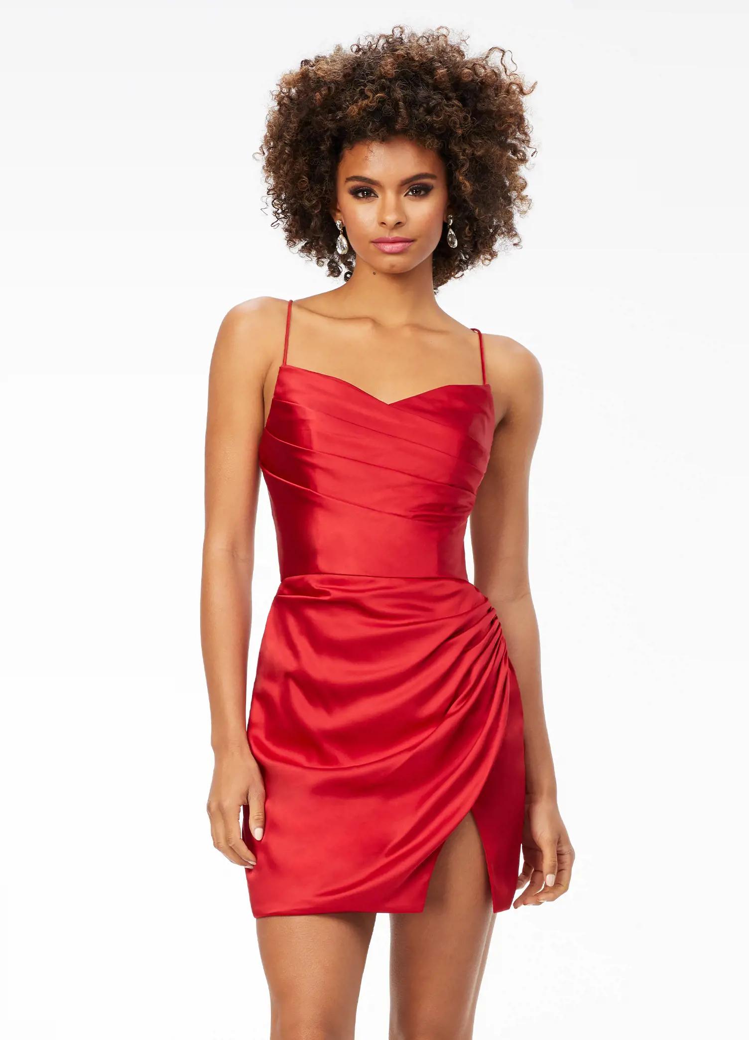 Red ASHLEYlauren 4513 satin cocktail dress featuring spaghetti straps, an exquisitely draped bodice, wrap fitted skirt with a left leg slit, and an open lace-up back for an elegant and sophisticated look.