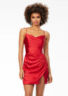 Red ASHLEYlauren 4513 satin cocktail dress featuring spaghetti straps, an exquisitely draped bodice, wrap fitted skirt with a left leg slit, and an open lace-up back for an elegant and sophisticated look.