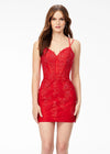 Red ASHLEYlauren 4541 lace cocktail dress featuring delicate spaghetti straps, scattered lace appliques, heat set stones, a fitted skirt, and a lace-up back for an elegant and refined look.