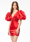 Red ASHLEYlauren 4549 cocktail dress featuring a V-neckline, oversized puff sleeves, heat set stone-embellished waistband, fitted skirt, and center lace-up back for a bold and glamorous look.