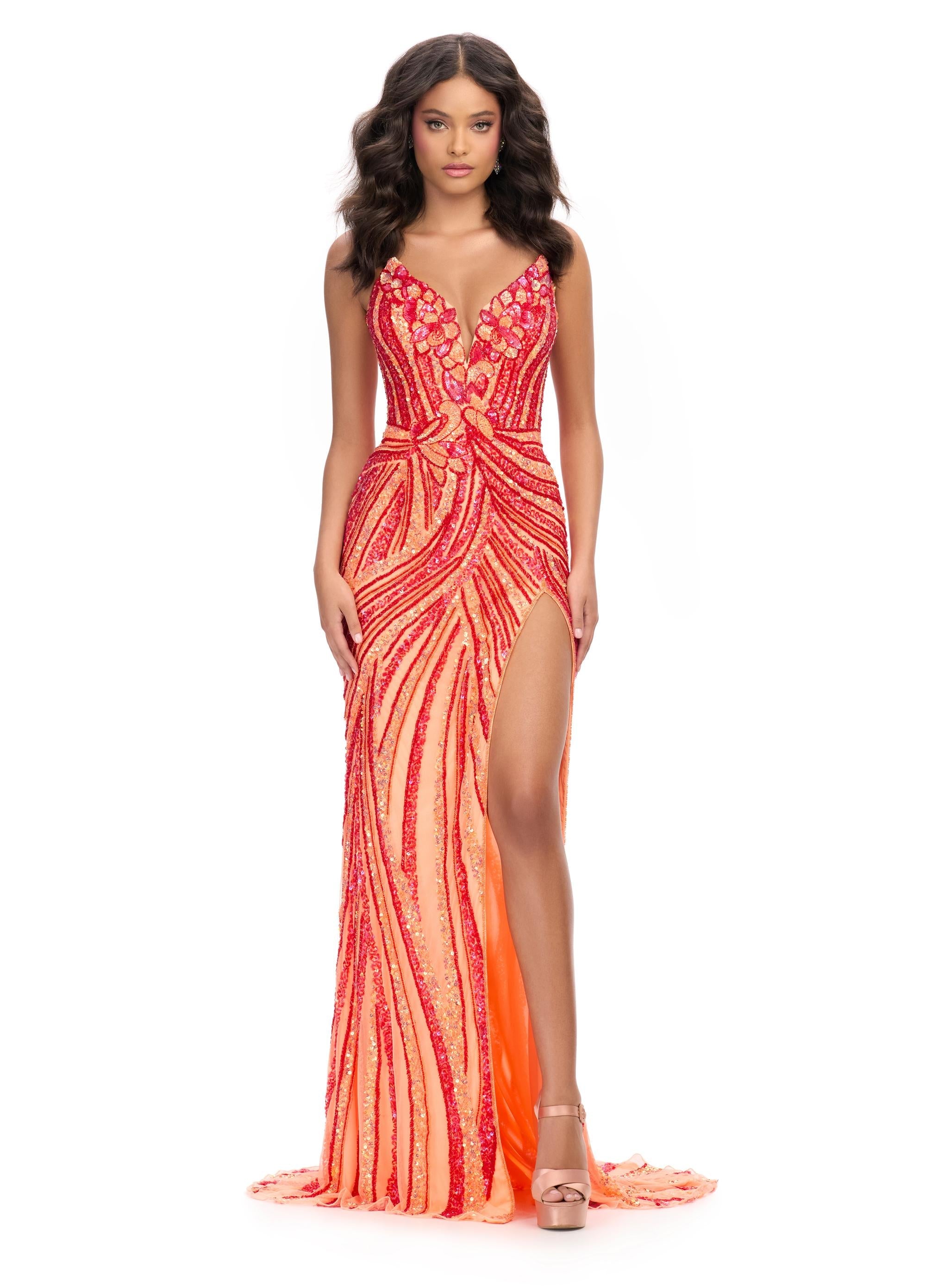 Red/Coral ASHLEYlauren 11236 strapless gown featuring a sweetheart neckline, modern floral sequin motif cascading down the bustier and skirt, and a left leg slit for a glamorous and head-turning look.
