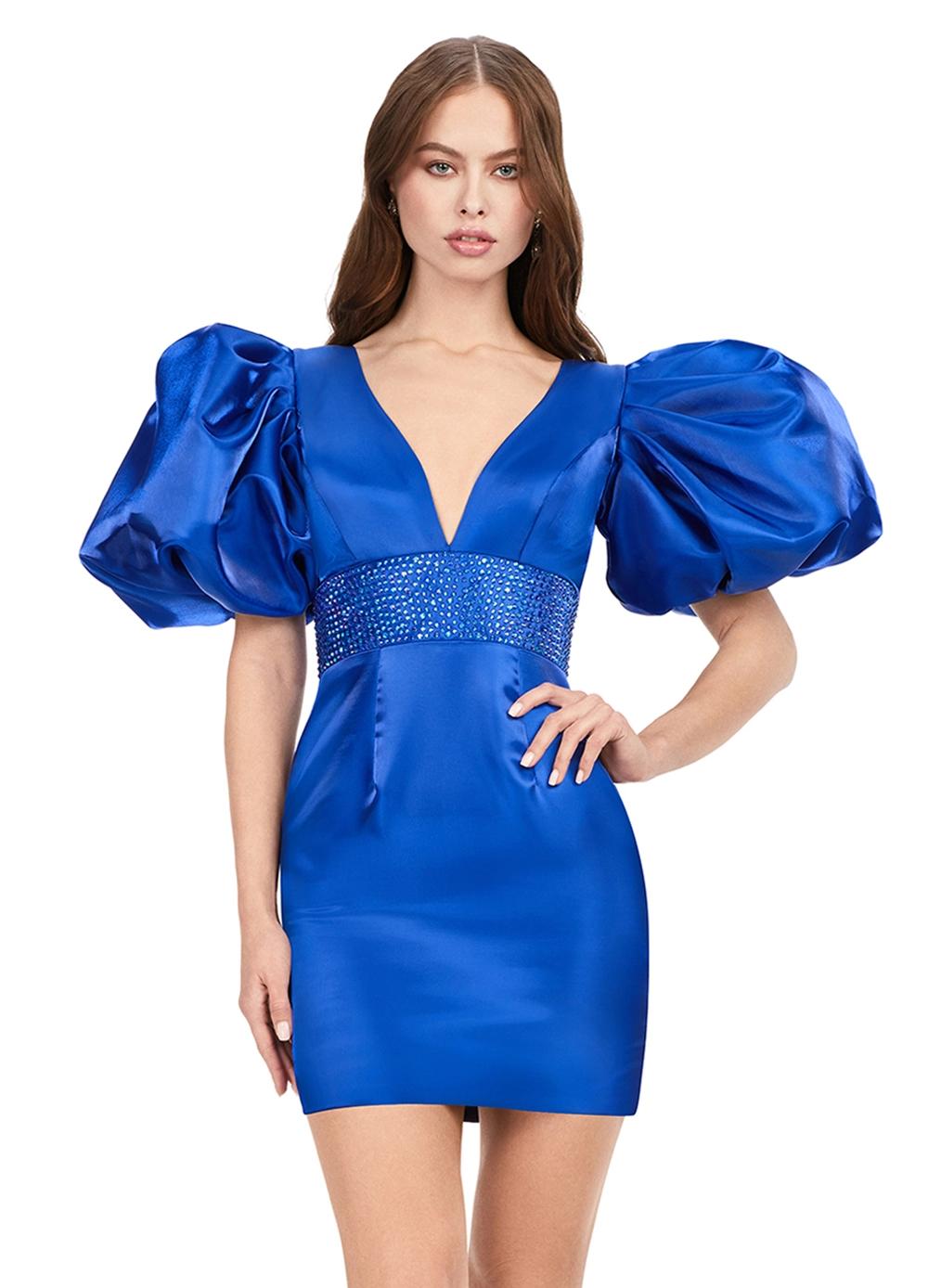 Royal ASHLEYlauren 4549 cocktail dress featuring a V-neckline, oversized puff sleeves, heat set stone-embellished waistband, fitted skirt, and center lace-up back for a bold and glamorous look.