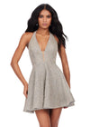 Silver ASHLEYlauren 4677 fully crystal beaded cocktail dress featuring a deep V-neckline, halter design, open back, and a flirty A-line skirt for a glamorous and head-turning look.