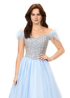 Sky ASHLEYlauren 11314 off shoulder gown featuring feather straps, a crystal-encrusted bustier, and a flowing organza A-line skirt with wire hem.