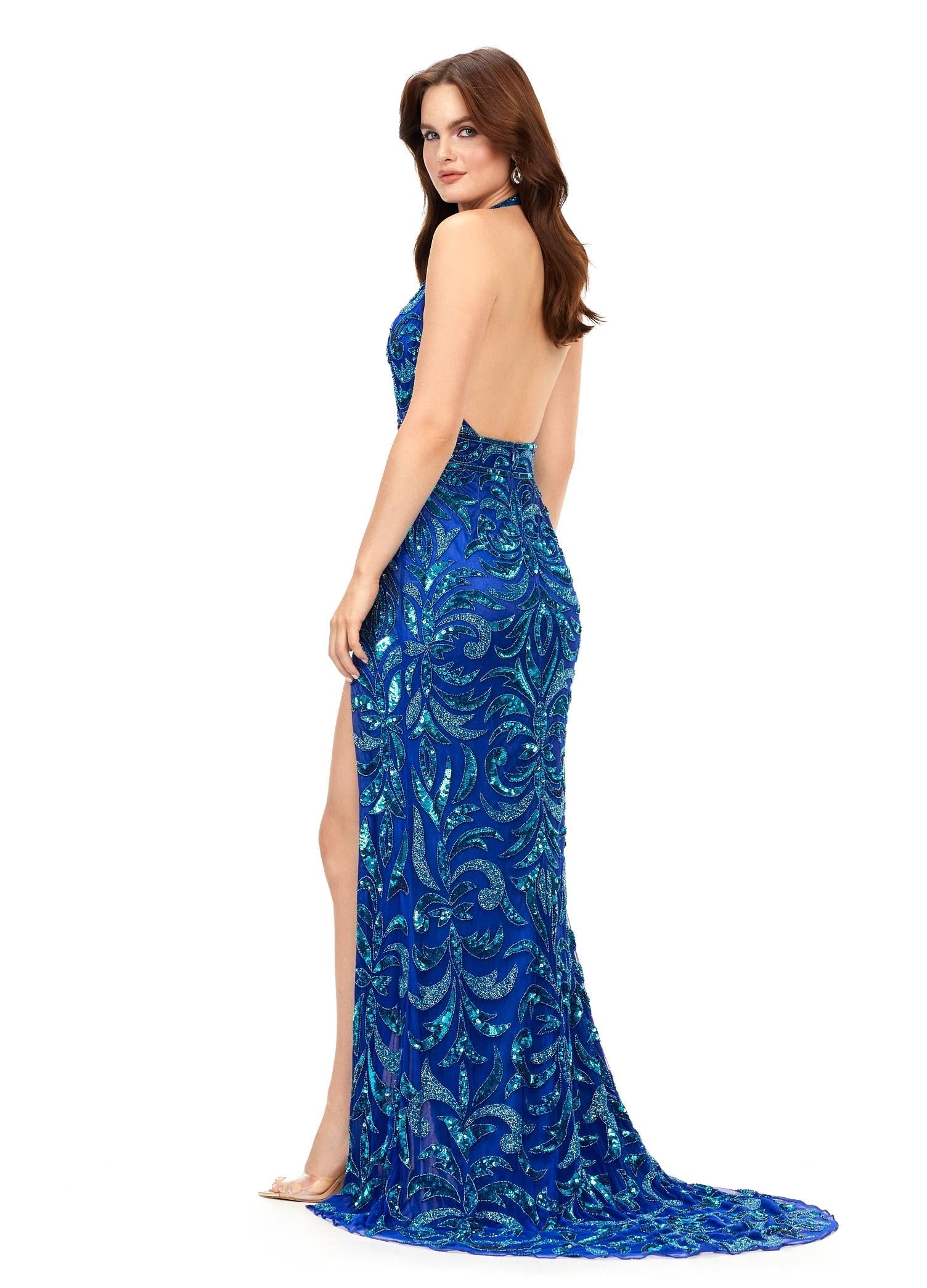 Back - Turquoise/Royal ASHLEYlauren 11283 halter gown featuring a V-neckline, open back, intricate beading throughout, and a left leg slit.