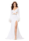 White ASHLEYlauren 11308 striking scuba gown featuring a deep V-neckline, criss-cross cut out bodice, crystal waistline, long sleeves adorned with heat-set stones and feather trim, a fitted skirt, and a left leg slit for a bold and glamorous statement look.