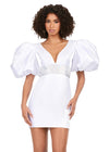 White ASHLEYlauren 4549 cocktail dress featuring a V-neckline, oversized puff sleeves, heat set stone-embellished waistband, fitted skirt, and center lace-up back for a bold and glamorous look.