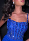Video - Royal ASHLEYlauren 11664 fitted jersey gown featuring a fully beaded corset bustier, spaghetti straps, lace-up back, ruched waist detailing, and a left leg slit for a sleek and glamorous look.