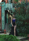 Video - Editorial. Black ASHLEYlauren 11690 Glamorous Strapless Gown with Exposed Corset Boning Encrusted in Press On Stones, Ruched Skirt, and Left Leg Slit