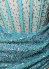 Video -Turquoise ASHLEYlauren 4564 strapless cocktail dress featuring an illusion bustier with exposed boning and a wrap sequin skirt for a modern and sophisticated look.