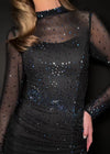 Video - Back. Black ASHLEYlauren 11742 glamorous evening gown featuring a mesh high neckline, ruched waistline, press-on stone embellishments, left leg slit, and a sweep train for an elegant and sophisticated look.