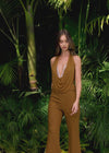 Video - Bronze ASHLEYlauren 11775 standout jumpsuit featuring a halter neckline, illusion deep V-neckline adorned with crystal press-on stones, and a sleek silhouette for a bold and glamorous look.