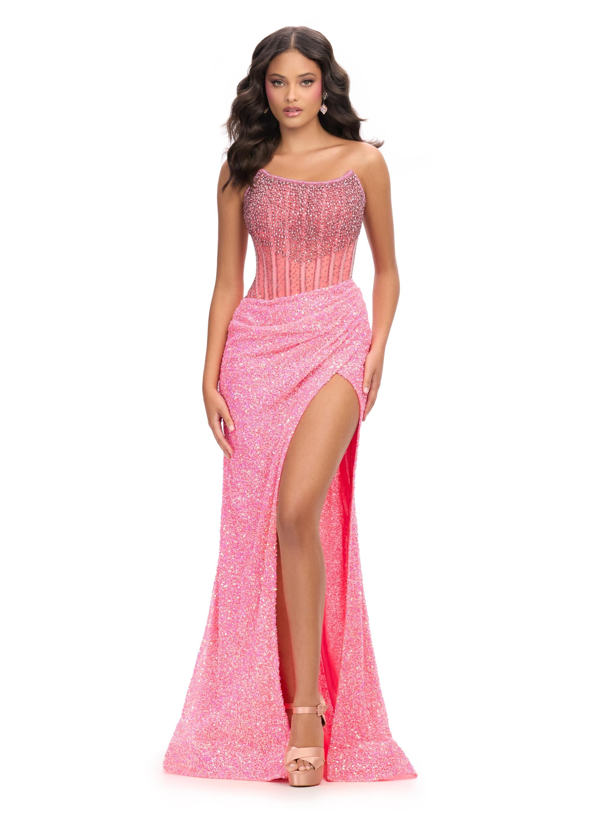 ASHLEYlauren 11238 | Pink jaw-dropping strapless gown featuring a fitted silhouette, corset bustier with stunning crystal beadwork, a fully beaded wrap skirt, and a left leg slit for a glamorous red carpet-worthy look.