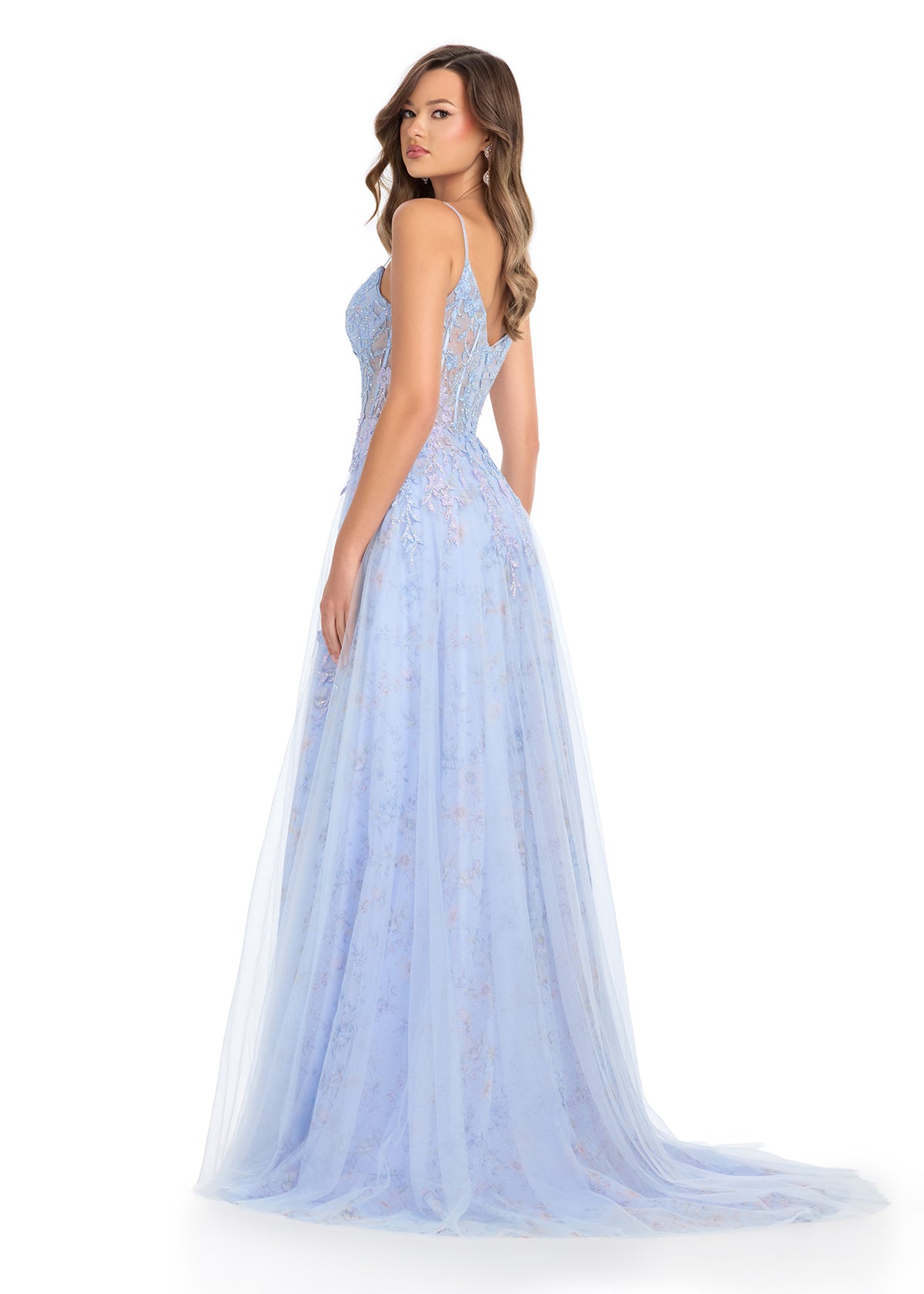 Back -  Fit for a princess, this stunning gown features a structured corset bustier with delicate spaghetti straps, intricate appliqué cascading onto the skirt, and a left leg slit for an elegant and romantic touch. Perfect for special occasions.