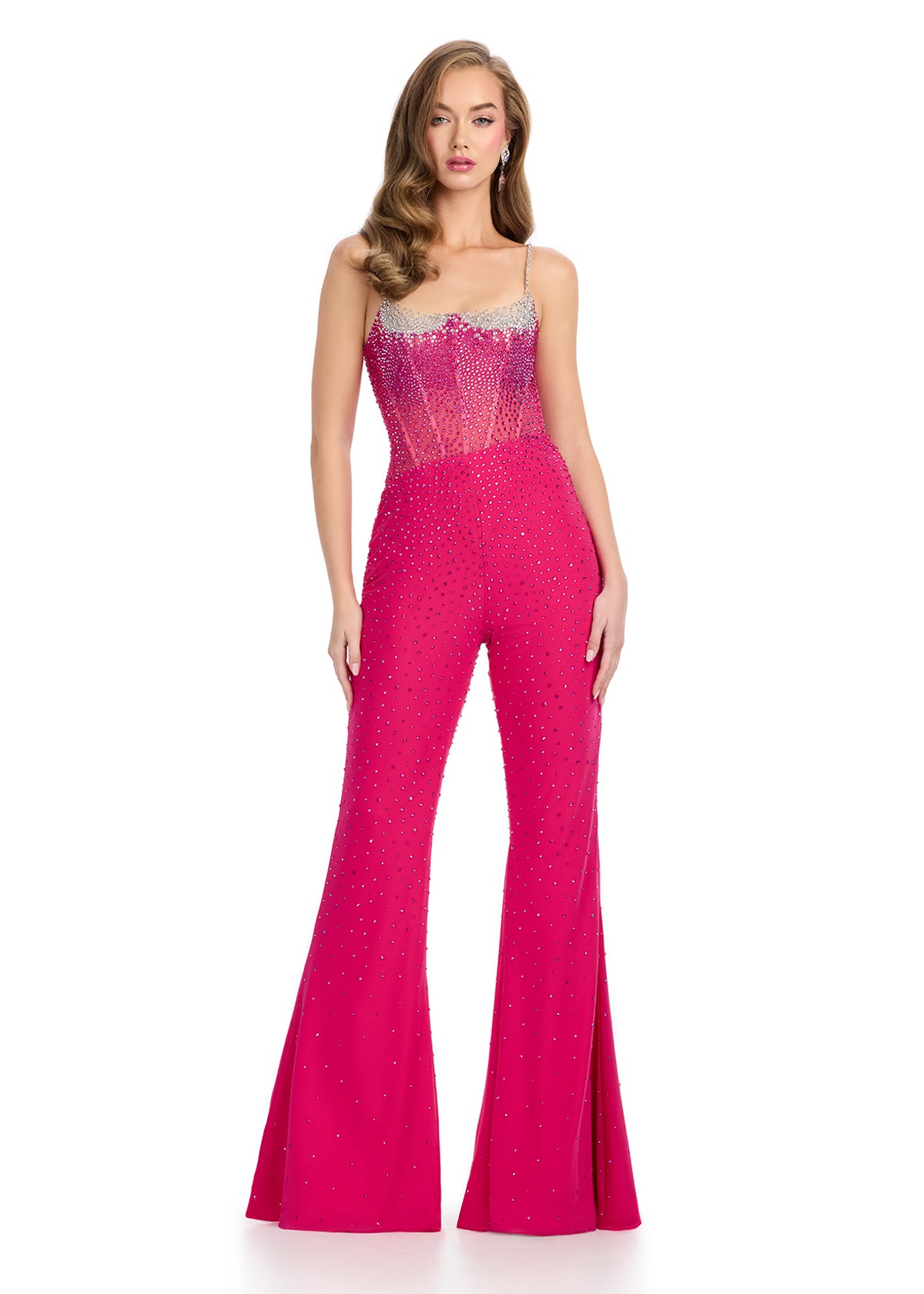 Glamorous corset jumpsuit featuring a structured bustier with spaghetti straps, dazzling press-on stones, flared bottoms, and a stunning sheer back. The perfect blend of elegance and versatility for any occasion.