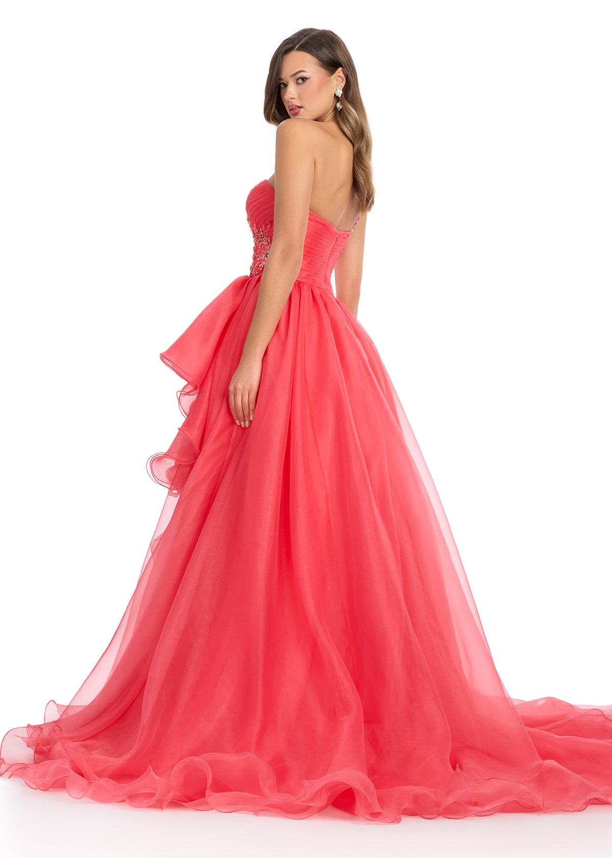  Princess-worthy organza ball gown featuring a sweetheart neckline, intricate beaded details on the bodice and one-shoulder strap, and cascading ruffles that enhance the left leg slit for an elegant and regal look. Perfect for special occasions.