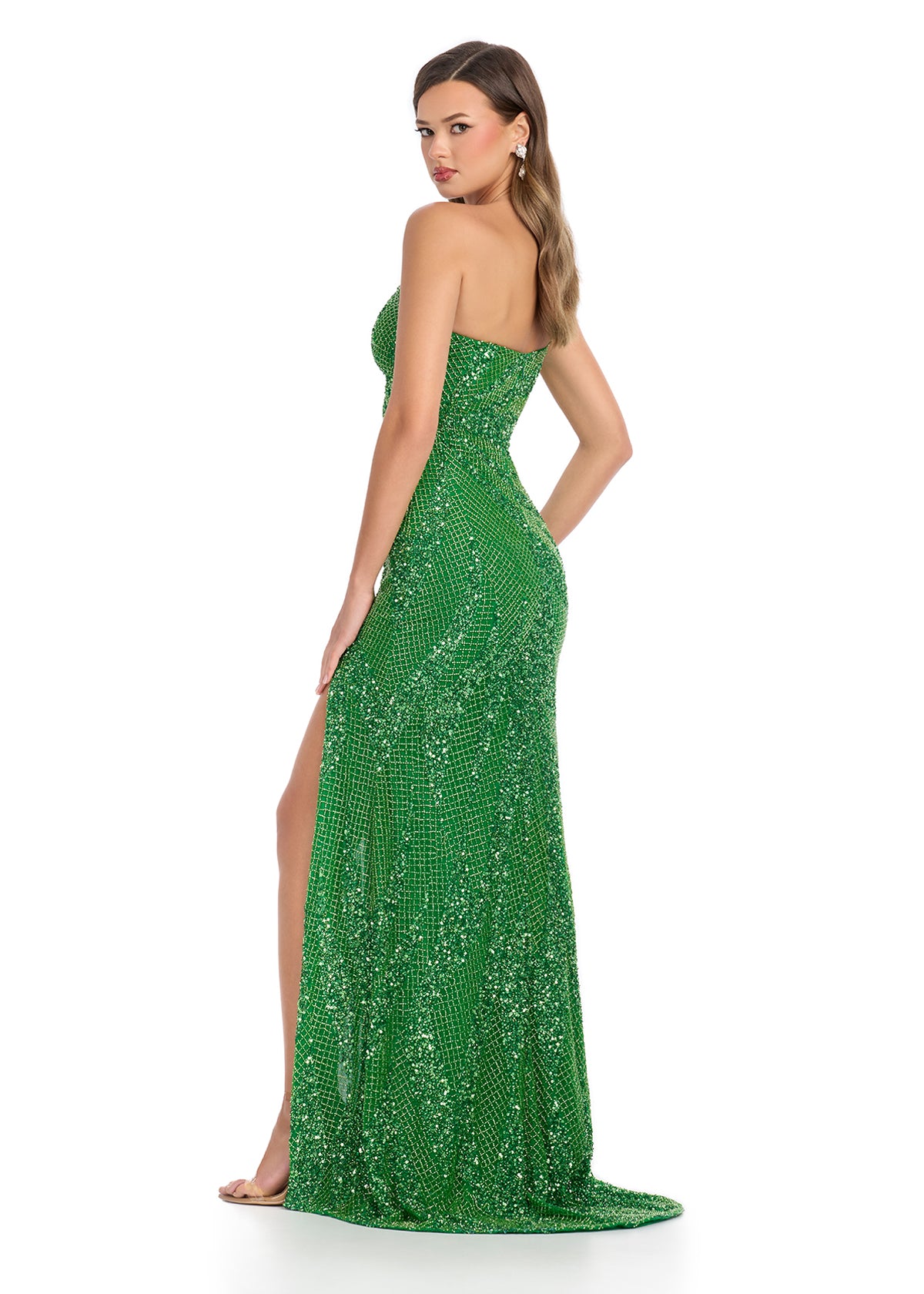  Dazzling fully beaded one-shoulder gown featuring an asymmetric cut-out and a left leg slit for a bold and glamorous entrance. Perfect for special occasions.