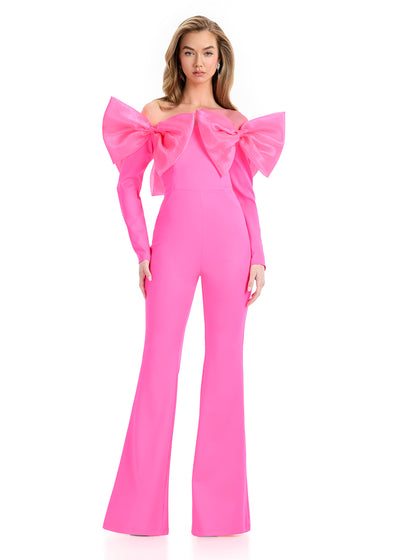 ASHLEYlauren 12089 Jumpsuit | Hot Pink fitted scuba jumpsuit featuring a structured bodice, flared leg, and dramatic bow detail that exudes playful glamour.