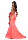ASHLEYlauren 12212 | Coral fitted mikado gown featuring structured bodice, bold bow ruffle, and elegant sweep train. Back