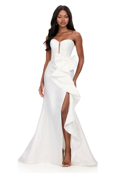 ASHLEYlauren 12212 | White mikado gown featuring fitted bodice, dramatic bow ruffle, and structured strapless silhouette