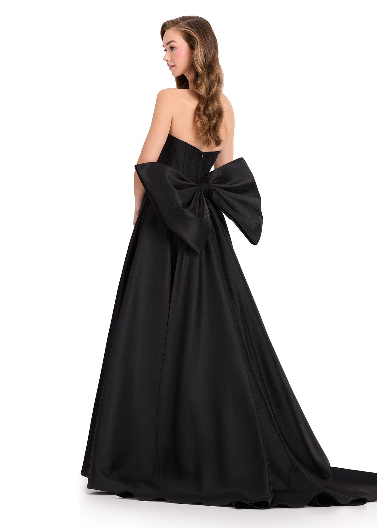 ASHLEYlauren 12387 Gown | Black glamorous mikado prom dress with strapless deep plunge sweetheart neckline and back of the waist statement bow