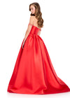 ASHLEYlauren 12399 Gown | Strapless Red satin evening gown with a structured corset back, soft draped accents, and an elegant extended train