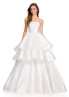 ASHLEYlauren 12400 Gown | Ivory Satin ball gown featuring a sleek strapless neckline, dramatic tiered skirt detailing, and a structured silhouette with elegant volume