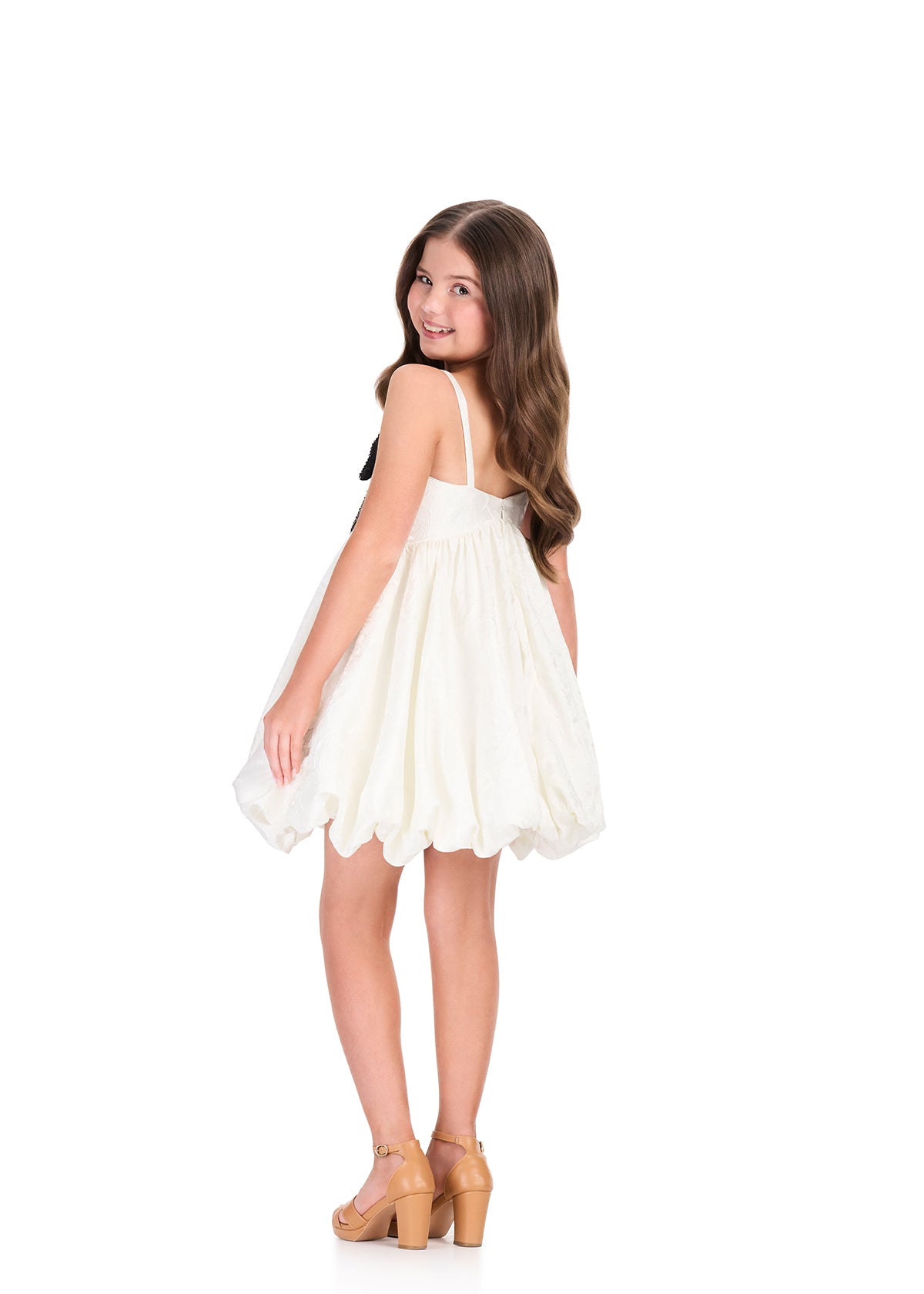 ASHLEYlauren 8409 Cocktail | Stunning white kids cocktail dress that features thin straps with a black sparkly bow