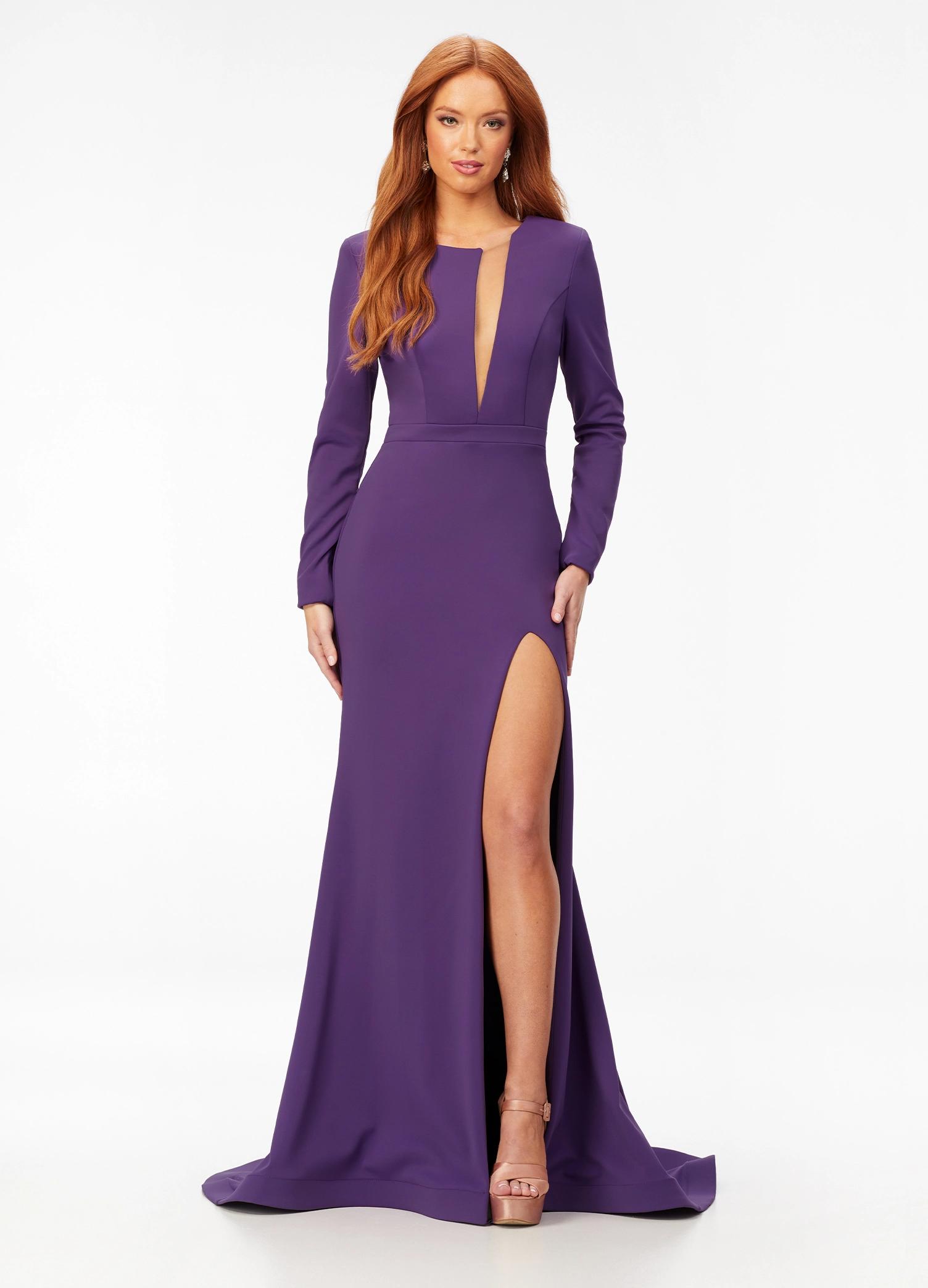 ASHLEYlauren 11019 Black Orchid long sleeve scuba dress featuring a crew neckline bustier with an asymmetrical illusion cut out, left leg slit, and horsehair hem for a sleek and sophisticated look.