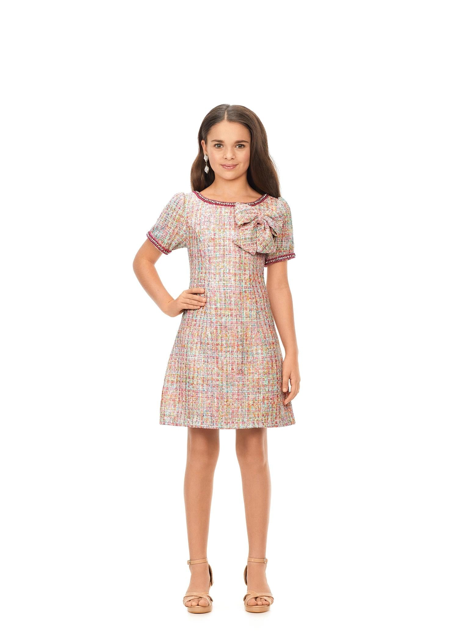 ASHLEYlauren Kids 8172 multi tweed cocktail dress featuring a crew neckline, short sleeves trimmed with pearls and crystals, and a beautiful bow detail on the bodice for a chic and elegant look.