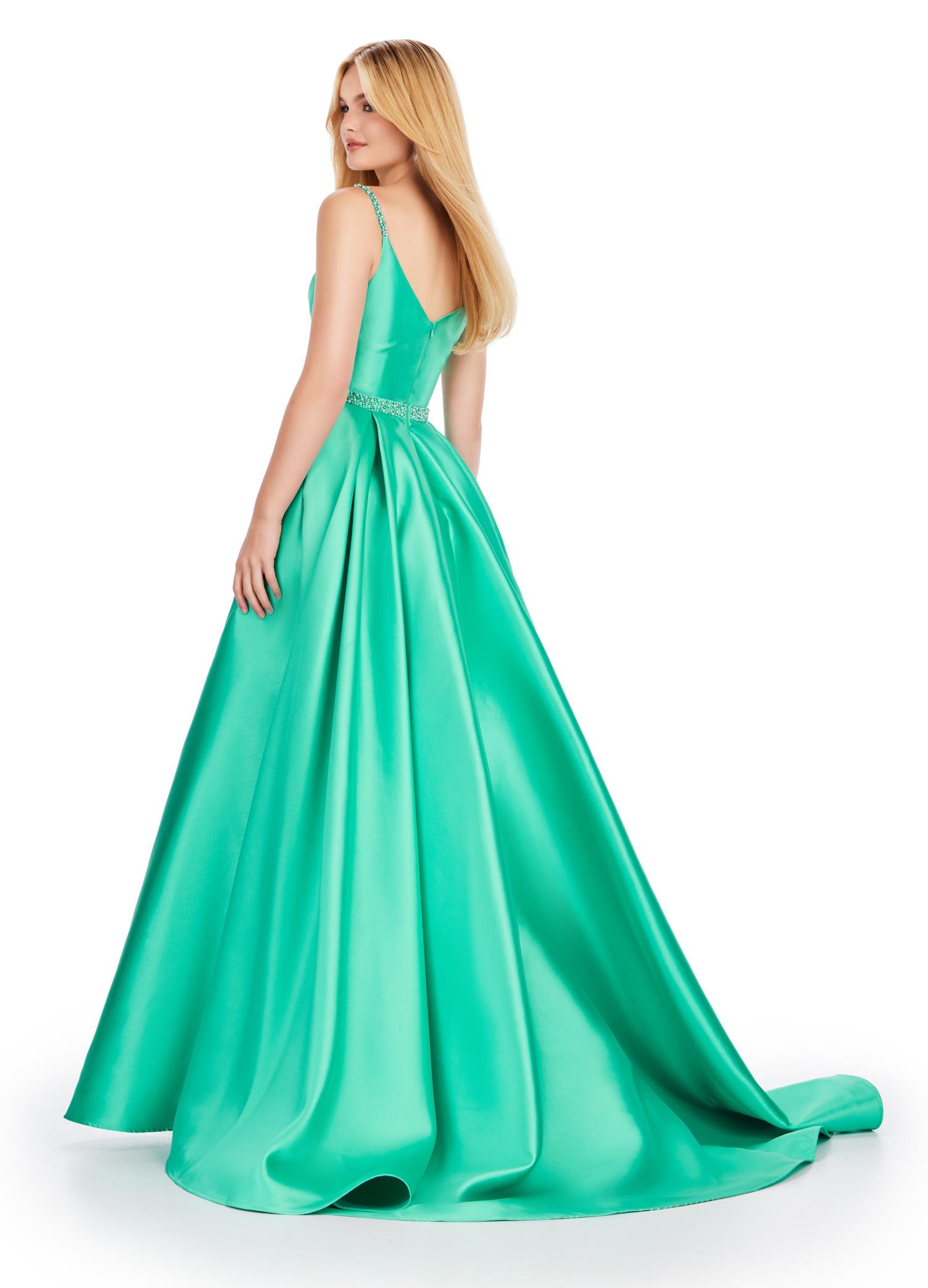Back. Aqua ASHLEYlauren 11540 one shoulder Mikado gown featuring elegant draping, a fitted skirt with a dramatic side skirt, spaghetti straps, and a unique lace-up V-back for a striking and sophisticated look.