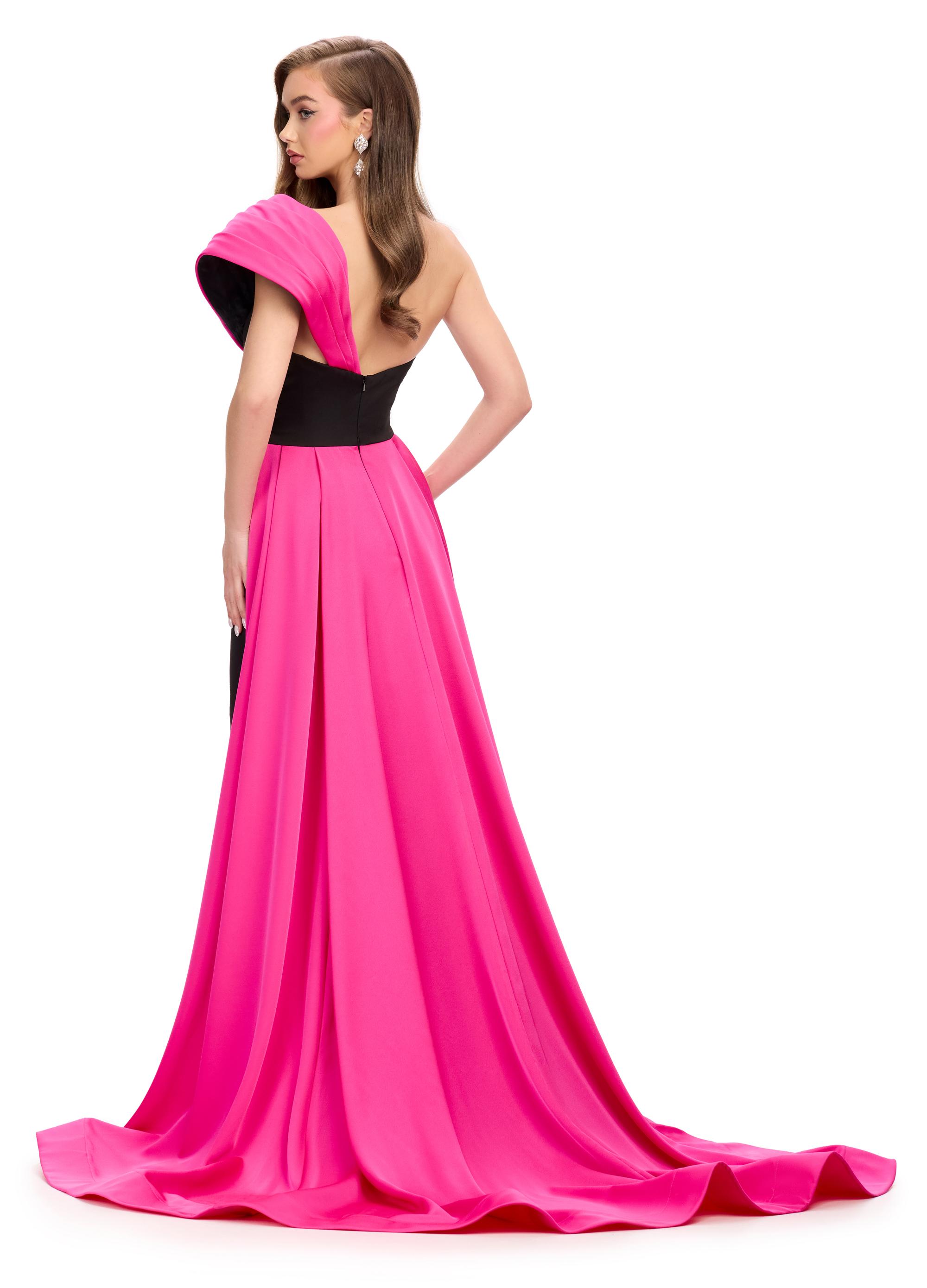 Back. Black/Fuchsia ASHLEYlauren 11735 stunning satin gown featuring a unique one shoulder design, fitted skirt, and dramatic A-line overskirt for a regal and sophisticated look.