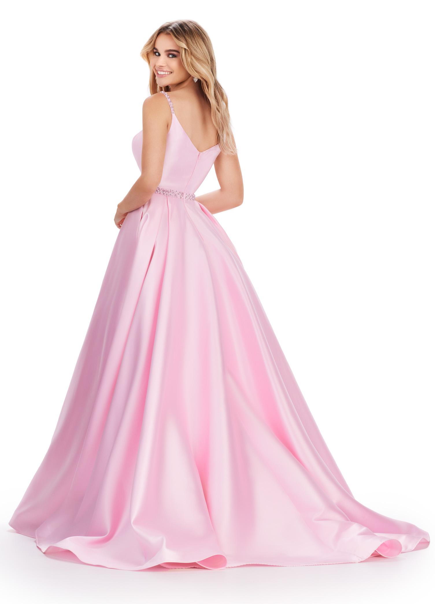 Back. Ice Pink ASHLEYlauren 11540 one shoulder Mikado gown featuring elegant draping, a fitted skirt with a dramatic side skirt, spaghetti straps, and a unique lace-up V-back for a striking and sophisticated look.