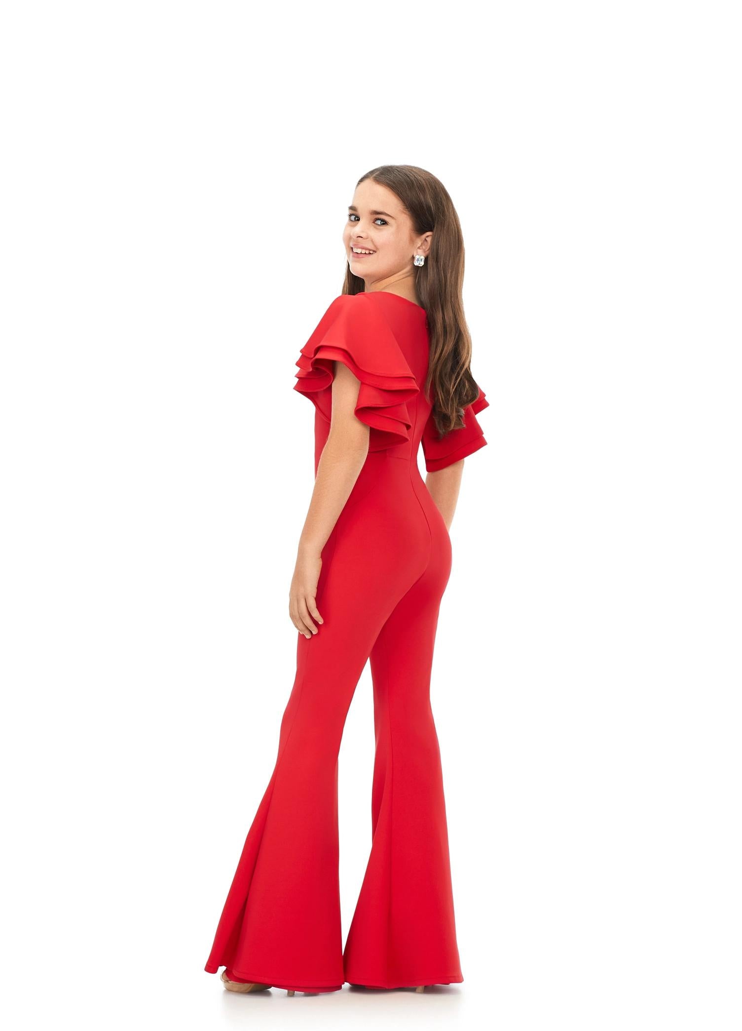 Back. Red ASHLEYlauren Kids 8156 versatile scuba jumpsuit featuring a classic crew neckline, playful ruffle sleeves, and flare bottom pants for a fun and stylish look.