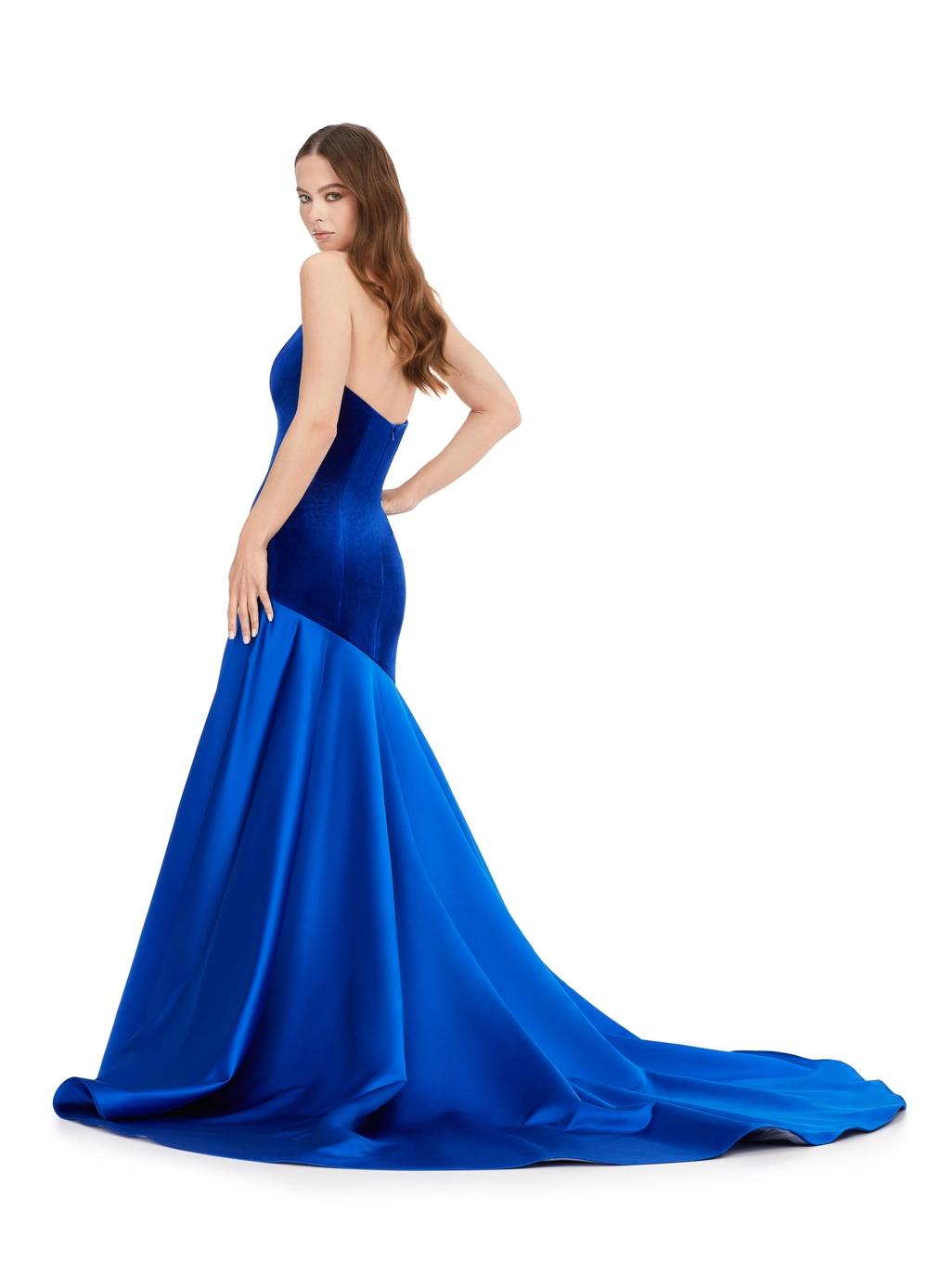 Back. Royal ASHLEYlauren 11264 show-stopping mermaid gown featuring a deep V-neckline, luxurious velvet bustier, asymmetrical satin flare skirt, and a sweep train for a bold and glamorous statement look.