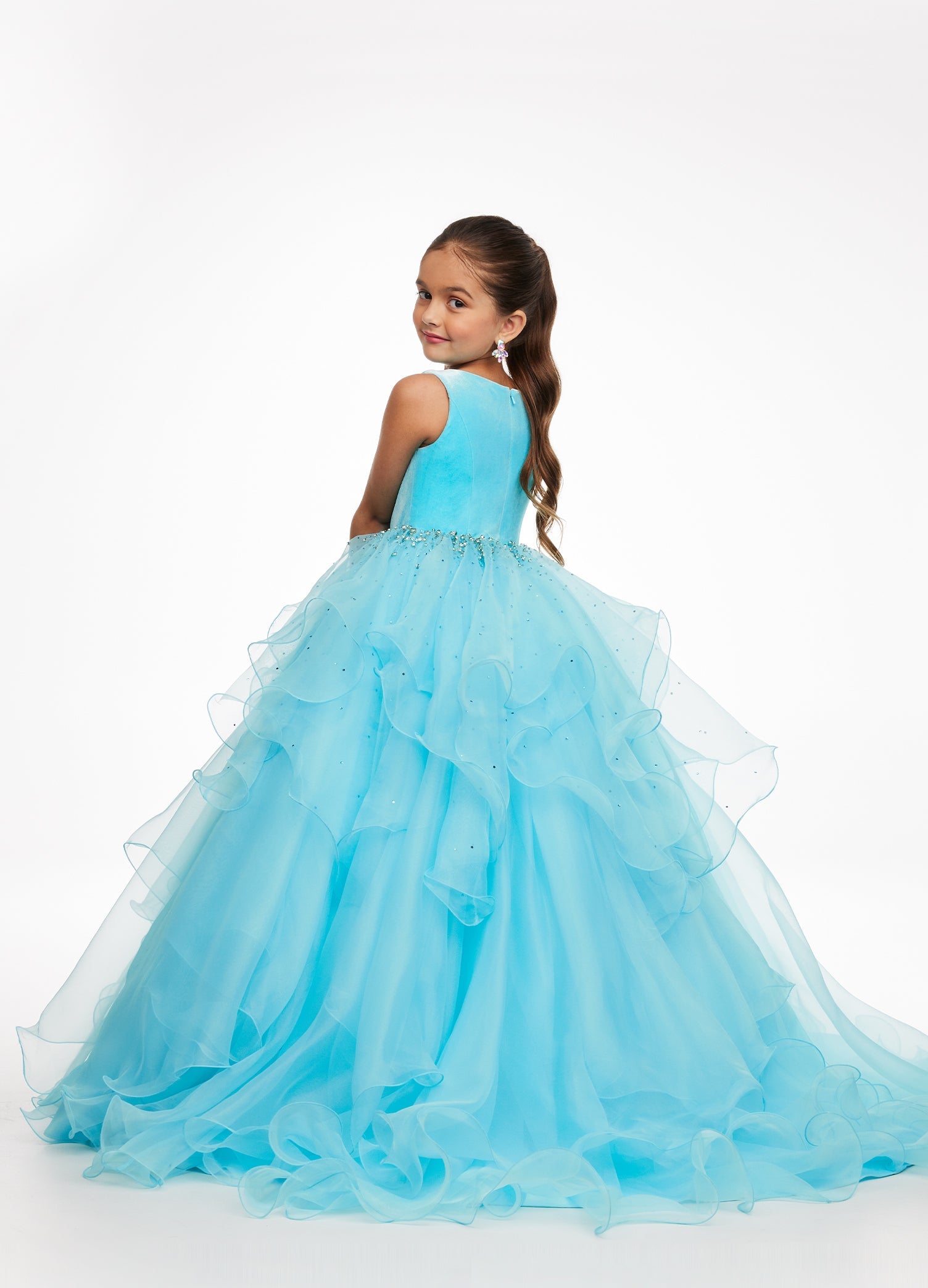 Back. Sky ASHLEYlauren Kids 8120 elegant ball gown featuring a crew neckline, velvet bustier, beaded waistline, and cascading press-on stone details over a handkerchief organza skirt for a sophisticated and graceful look.