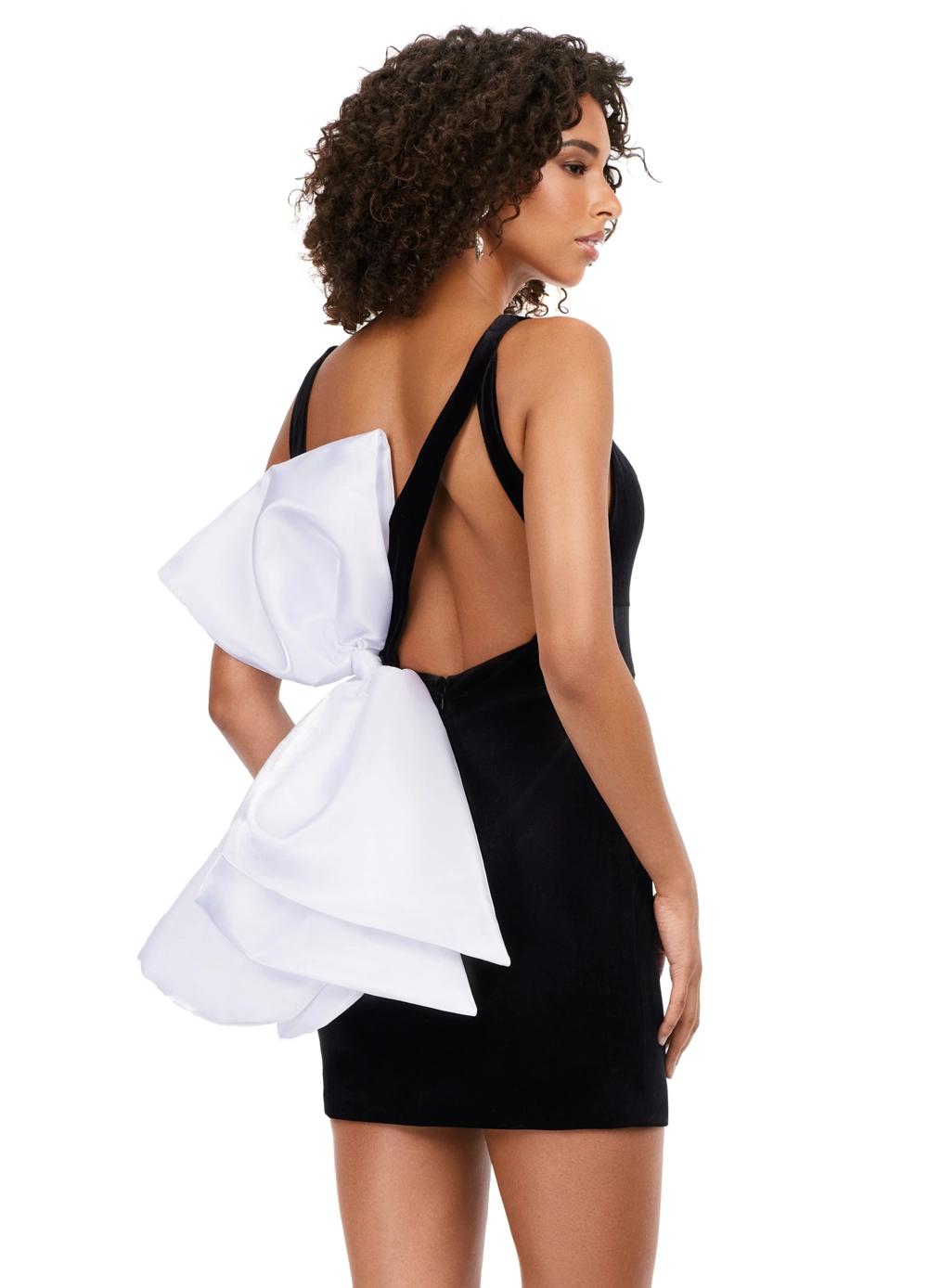 Back - Black/White ASHLEYlauren 4646 velvet cocktail dress featuring a V-neckline, fitted skirt, and an asymmetric oversized satin bow at the back for a bold and glamorous statement look.