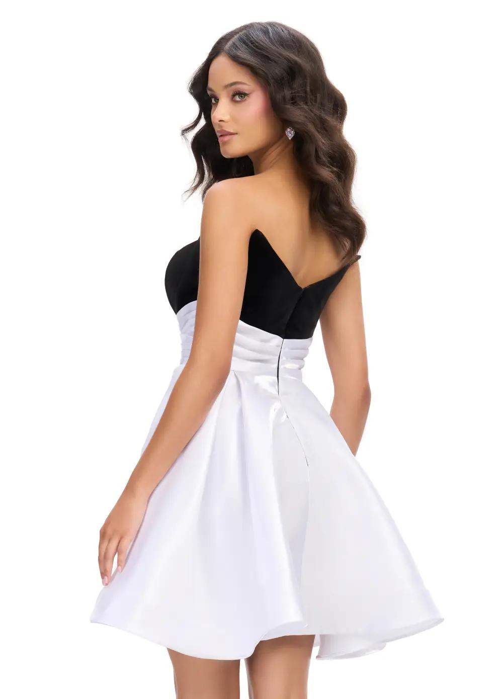 Back - Black/White ASHLEYlauren 4734 strapless stretch velvet cocktail dress featuring a fitted skirt, satin wrap belt, and an A-line satin overskirt for an elegant and sophisticated look.