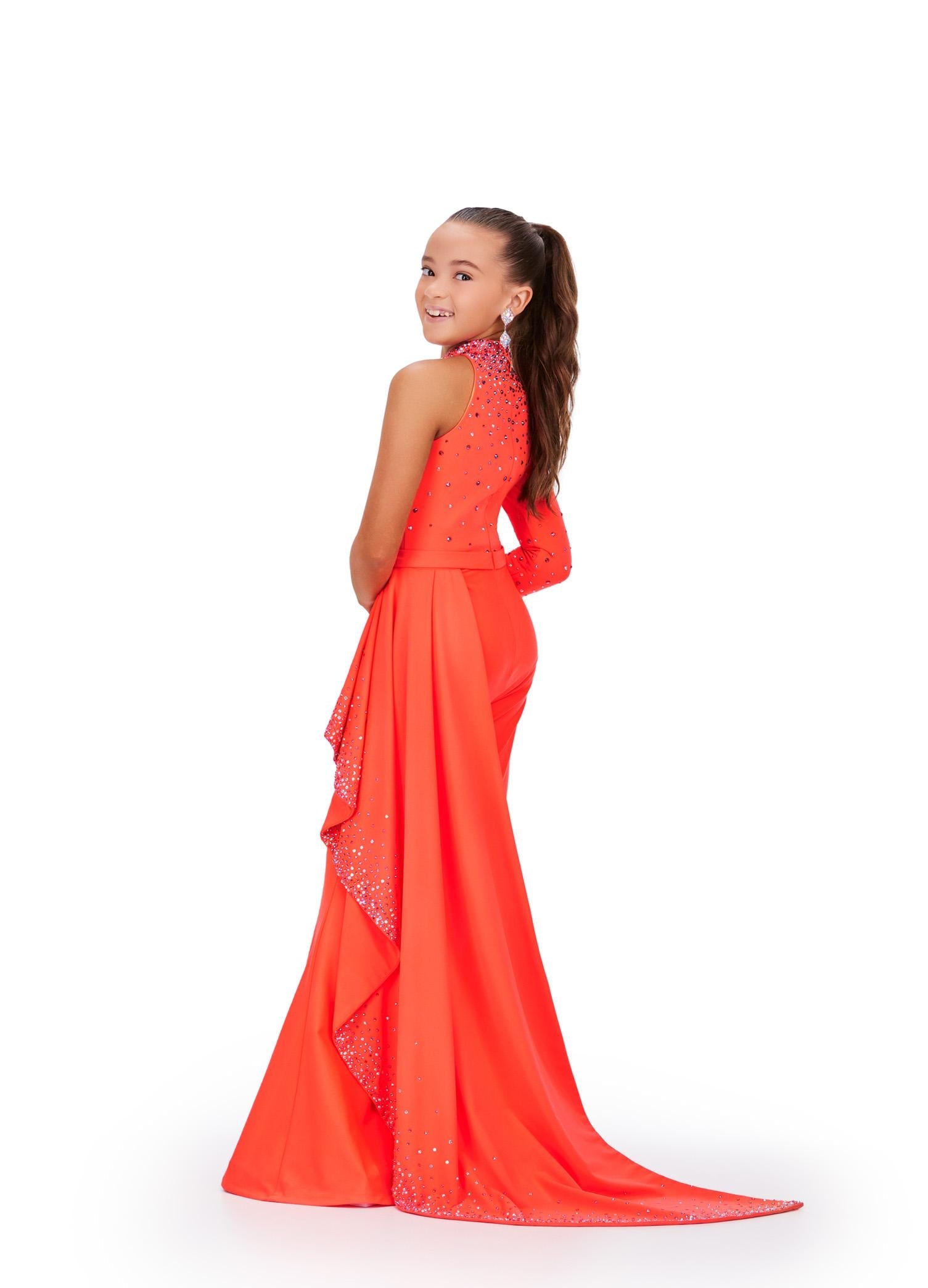 Back - Neon Orange ASHLEYlauren 8253 stylish scuba jumpsuit featuring a high neckline, one sleeve embellished with scattered heat-set stones, and a side ruffle skirt adorned with matching beaded details for a bold and sassy look.