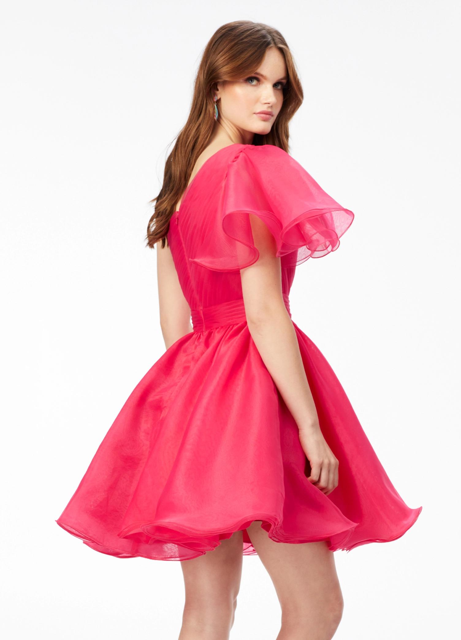 Back - Pink ASHLEYlauren 4524 organza cocktail dress featuring a one shoulder neckline with a flutter sleeve, an A-line skirt with a wire hem for added structure, and a playful, sassy vibe.
